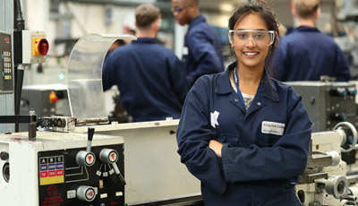 Student in protective gear with machinery