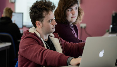 Students looking at a computer screen