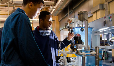 Students operating machinery