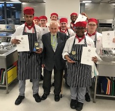 group photo of chefs holding certificates